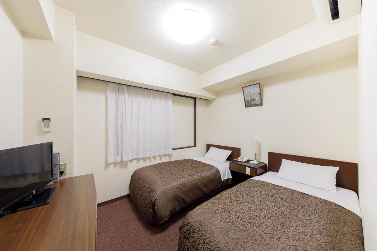 Dai-Ni Sunny Stone Hotel Suita Exterior foto